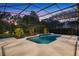 Beautiful screened pool area with a lovely landscape view and patio at 10849 Emerald Chase Dr, Orlando, FL 32836