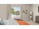 Bright bedroom with lake views from the window, neutral carpet and decor at 1103 Lindley Cove Cir, Deland, FL 32724