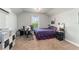 Bedroom features office setup, carpet floors, neutral paint, tray ceilings, and an abundance of natural light at 1103 Lindley Cove Cir, Deland, FL 32724