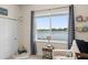 Light-filled Bedroom featuring a ceiling fan, a large window with a lake view, and modern furnishings at 1103 Lindley Cove Cir, Deland, FL 32724