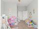 A bedroom featuring a play area, a ceiling fan, carpet floors and an abundance of natural light at 1103 Lindley Cove Cir, Deland, FL 32724