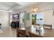 Bright dining area featuring sliding glass doors that open to a waterfront view, creating a serene atmosphere at 1103 Lindley Cove Cir, Deland, FL 32724