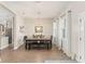 Elegant dining room with a large dining table, wood floors, and ample natural light at 1103 Lindley Cove Cir, Deland, FL 32724