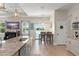 Open concept kitchen with stainless appliances plus eat-in counter, overlooking the dining and living areas at 1103 Lindley Cove Cir, Deland, FL 32724