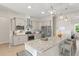 Modern kitchen with stainless steel appliances, granite countertops, and an eat-in bar overlooking the living area at 1103 Lindley Cove Cir, Deland, FL 32724