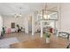 Open concept living area with wood floors, and direct access to the kitchen and dining area at 1103 Lindley Cove Cir, Deland, FL 32724