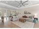 Bright and airy living room with a coffered ceiling, comfortable seating, and stylish decor at 1103 Lindley Cove Cir, Deland, FL 32724