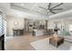 An open-concept living space with modern appliances, dining, and living areas flowing seamlessly together at 1103 Lindley Cove Cir, Deland, FL 32724