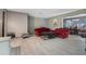 Spacious living room with light gray walls and gray tile flooring at 1136 Lakewood Park Dr, Daytona Beach, FL 32117