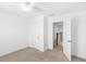 Neutral bedroom featuring carpet floors and natural light at 1168 Lakeshore Breeze Pl, Kissimmee, FL 34747