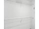 Walk-in closet features white walls and sturdy, coated-wire shelving for optimal storage and organization at 1168 Lakeshore Breeze Pl, Kissimmee, FL 34747
