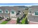 Exterior view of a townhome showcasing its well-maintained facade and landscaping at 1168 Lakeshore Breeze Pl, Kissimmee, FL 34747