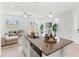 Stylish kitchen island featuring granite countertops, a sink, and seamless flow to the living area at 1168 Lakeshore Breeze Pl, Kissimmee, FL 34747