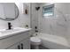 This clean bathroom offers updated vanity, marbled shower, and modern finishes at 1313 Pine Ridge Dr, Daytona Beach, FL 32117