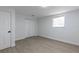 Neutral bedroom boasts modern floors, window, closet, and white door at 1313 Pine Ridge Dr, Daytona Beach, FL 32117