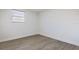 Bright bedroom with wood-look floors and a fresh coat of paint, ready for customization at 1313 Pine Ridge Dr, Daytona Beach, FL 32117