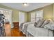 Charming bedroom with hardwood floors, neutral walls, and bright window at 1413 W Harvard St, Orlando, FL 32804