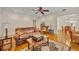 A living room features hardwood floors, archway to dining room, and comfortable seating at 1413 W Harvard St, Orlando, FL 32804