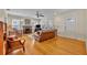 Bright living room with a brick fireplace, hardwood floors, and multiple windows at 1413 W Harvard St, Orlando, FL 32804