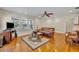 Spacious living room with hardwood floors, a ceiling fan, and plenty of natural light at 1413 W Harvard St, Orlando, FL 32804