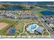 Expansive aerial view features community amenities including lakes, a pool, basketball court, and neatly planned residential streets at 15186 Book Club Rd, Winter Garden, FL 34787