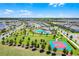 Stunning aerial view of the community pool, basketball court, clubhouse, and well-maintained lawns at 15186 Book Club Rd, Winter Garden, FL 34787