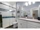 Stylish bathroom with glass shower, modern fixtures, and white vanity at 15186 Book Club Rd, Winter Garden, FL 34787