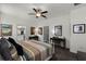 Bedroom featuring ceiling fan, closet, and en-suite bathroom at 15186 Book Club Rd, Winter Garden, FL 34787
