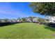 Community dog park with lush grass, a bench for owners, and secure fencing for a safe and fun environment at 15186 Book Club Rd, Winter Garden, FL 34787