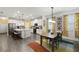 Open-concept kitchen and dining room featuring modern finishes and cohesive design elements at 15186 Book Club Rd, Winter Garden, FL 34787