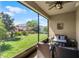 Enclosed lanai with comfortable seating and an outdoor grill and a great view of the lawn and garden at 15186 Book Club Rd, Winter Garden, FL 34787