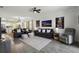 Open-concept living area with modern decor and seamless flow to the kitchen and dining spaces at 15186 Book Club Rd, Winter Garden, FL 34787