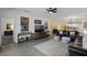 Open-concept living area with stylish decor, tile floors, and abundant natural light at 15186 Book Club Rd, Winter Garden, FL 34787