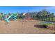 Well-maintained playground with climbing structures, slides, and soft mulch ground covering, surrounded by a secure fence at 15186 Book Club Rd, Winter Garden, FL 34787