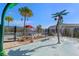 Fun splash pad with playful water features surrounded by lush landscaping and a nearby pool at 15186 Book Club Rd, Winter Garden, FL 34787