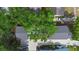 Aerial view of home with large tree in the front yard at 1521 E Harwood St, Orlando, FL 32803