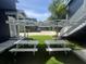 Backyard area with picnic tables and umbrellas at 1521 E Harwood St, Orlando, FL 32803