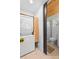 Modern bathroom with a shower, toilet, and stacked washer and dryer at 1521 E Harwood St, Orlando, FL 32803