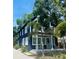 Stylish two-story home with a welcoming front porch, complete with rocking chairs and beautiful landscaping at 1521 E Harwood St, Orlando, FL 32803