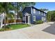 Charming two-story home with blue siding, white trim, inviting front entrance, and outdoor seating area at 1521 E Harwood St, Orlando, FL 32803