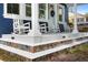 Close-up of a porch with rocking chairs and decorative tile leading up to the house at 1521 E Harwood St, Orlando, FL 32803