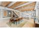 Bright living area showcases an open floor plan, exposed beams, and flows into the modern kitchen at 1521 E Harwood St, Orlando, FL 32803
