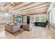 Comfortable living room featuring wood beamed ceilings and stylish decor at 1521 E Harwood St, Orlando, FL 32803