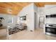 Bright living room showcasing light wood floors, a vaulted ceiling, and modern furnishings at 1521 E Harwood St, Orlando, FL 32803