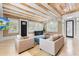 Comfortable living room featuring wood beamed ceilings and stylish decor at 1521 E Harwood St, Orlando, FL 32803