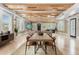 Open concept living room featuring wood-planked ceilings and tons of natural light at 1521 E Harwood St, Orlando, FL 32803