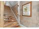 Modern staircase with hardwood steps and white risers at 1521 E Harwood St, Orlando, FL 32803