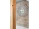 Round decorative mirror on the wall, adding a stylish touch to the interior design of the home at 1521 E Harwood St, Orlando, FL 32803