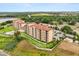 Stunning aerial view of the condo complex, showcasing the manicured grounds, pool, and surrounding landscape at 16300 County Road 455 # 204, Montverde, FL 34756