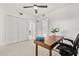Bright bedroom featuring a desk, carpet, ceiling fan, and closet at 16300 County Road 455 # 204, Montverde, FL 34756